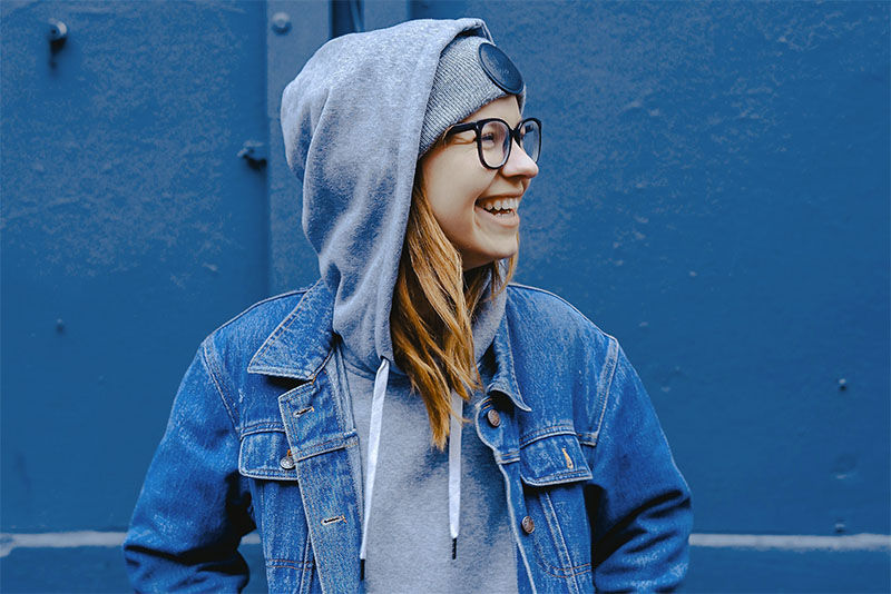 Girl smiling with blue background